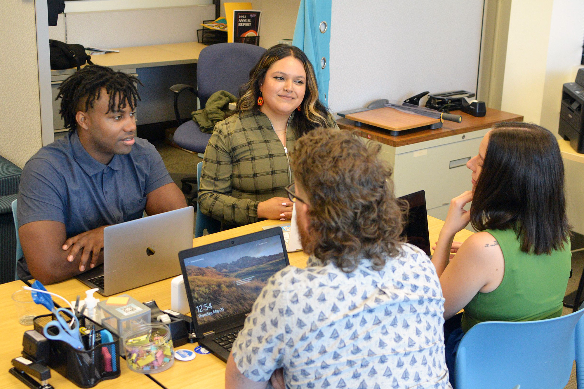 Paralegal students helping other students at a campus DACA workshop
