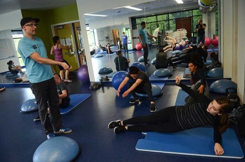 Students stretching and doing yoga