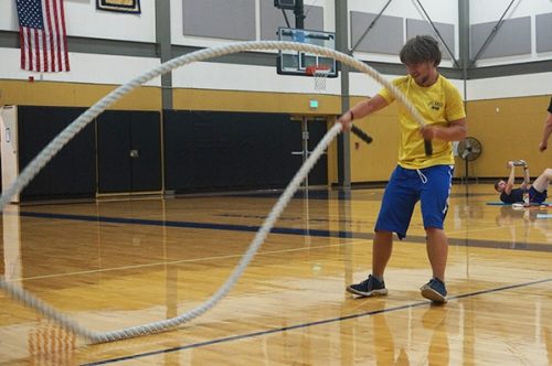 Student using a rope weight