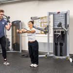 stretching muscles on workout machine