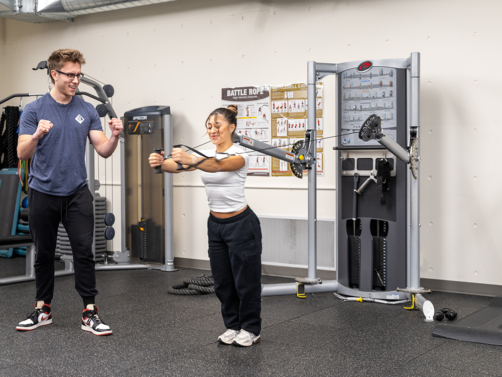 stretching muscles on workout machine