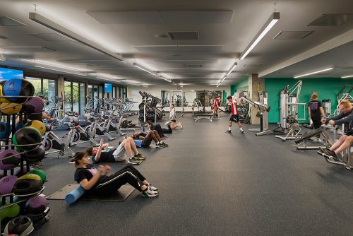 students exercising in open airy space