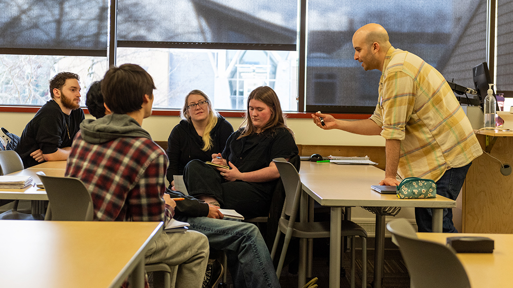 Students having a group discussion with their instructor