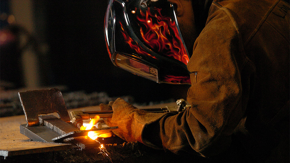 Student welding in the shop