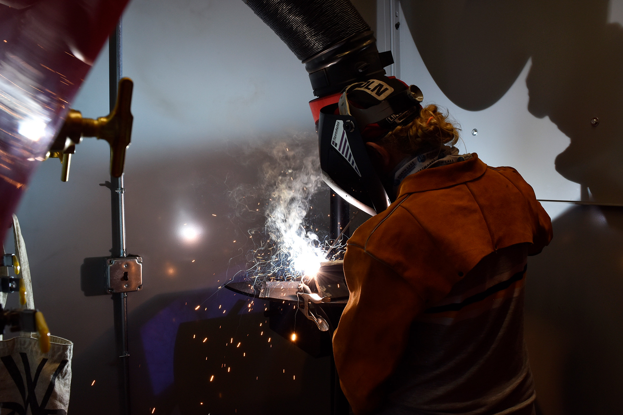 Student practicing shielded metal arc welding