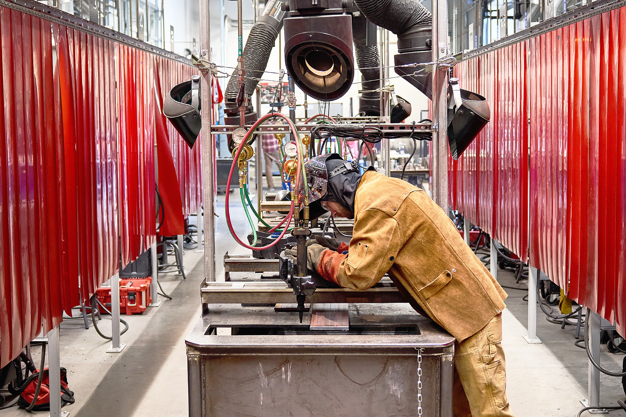Student working at a welding table in the shop
