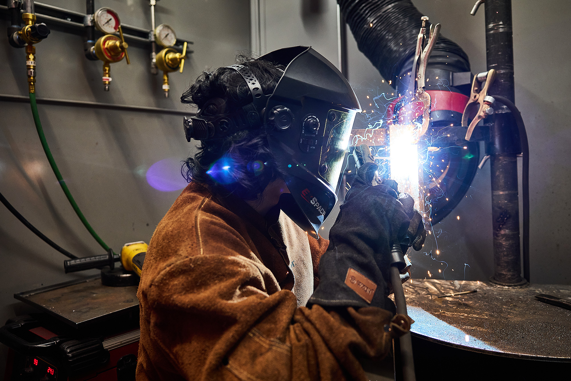 Student welding in the shop
