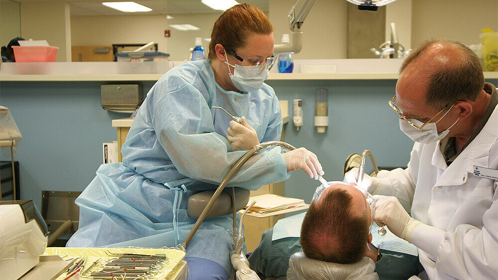 Student and instructor in a dental hygiene class