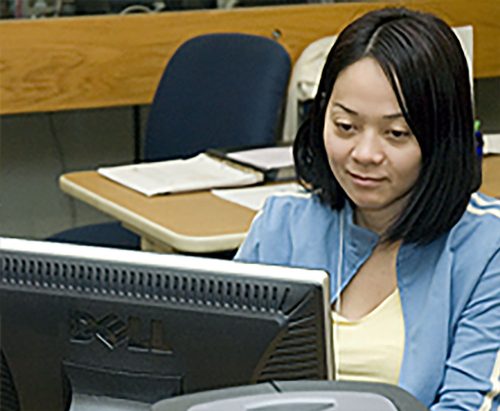 Non-Credit student in front of a computer