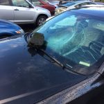 black car with smashed windshield