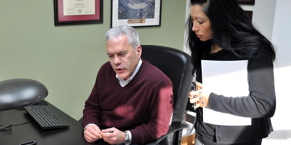 ACEs Pavement Services man and woman discussing business