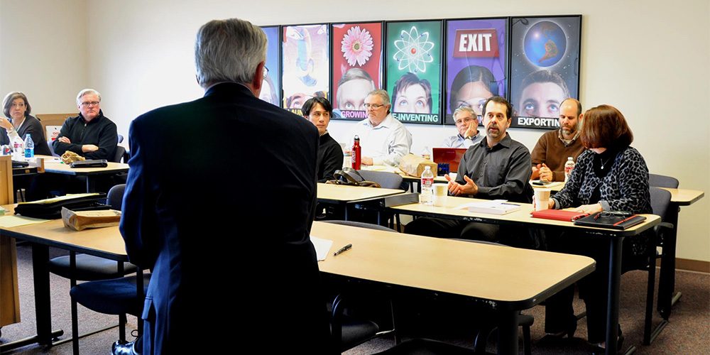 Instructor, back turned, leading CGBP Class