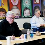 Man in green shirt takes practice test at PCC CLIMB