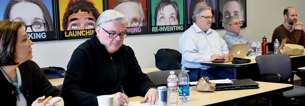 Students learning about the Global Business Professional exam in classroom at CLIMB