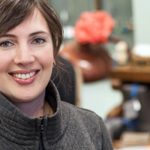 Celeste from Radish Underground smiling with business in background