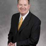 Instructor Jim Foley in a business suit