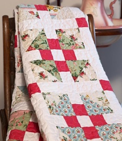 quilt top with red box and flowered fabrics