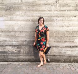 Instructor standing against a wall.