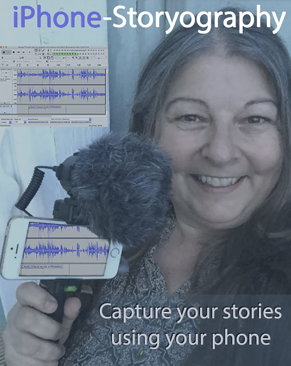 woman holding smartphone with mic attached while smiling at the camera