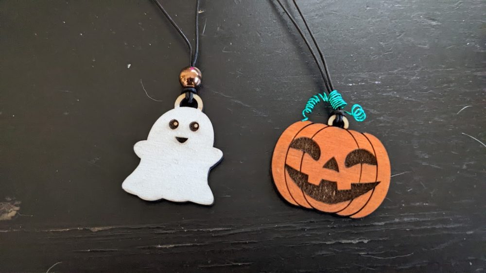 Laser cut ghost and jack-o-lantern necklace charms