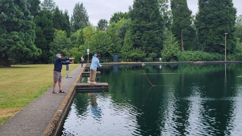 Fly fishing students practicing casting at Westmoreland Park casting pond