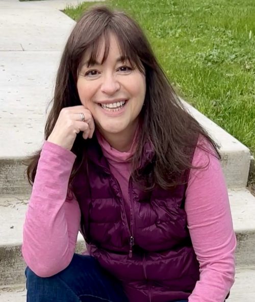 A photo of Community Ed instructor, Shannon Paul, M.Ed. Sitting on steps outside on a fall day.