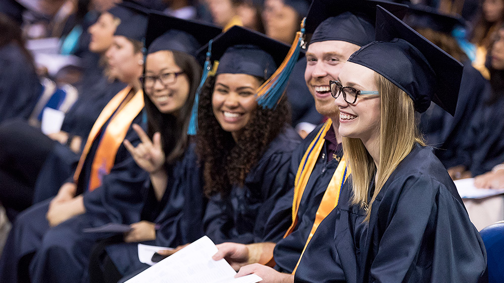 Students smiling at graudation