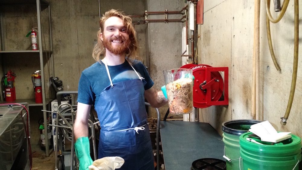 Student holding compost