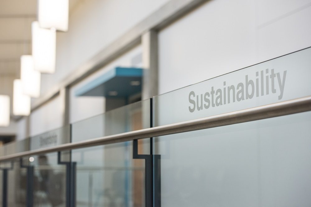 Sustainability text on glass railing