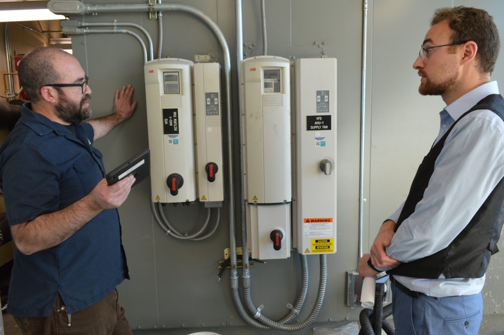 Jimmy Hood, FMS Specialist, and Farid Kayali, Strategic Energy Management Associate, take an energy operations tour at Rock Creek campus