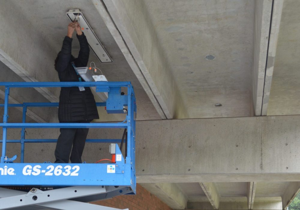 Facilities staff install LED lighting and remove ballasts at the Sylvania campus