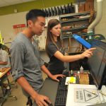 Two students using computer