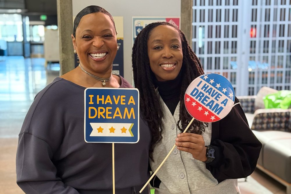 Staff members holding "I have a dream" signs