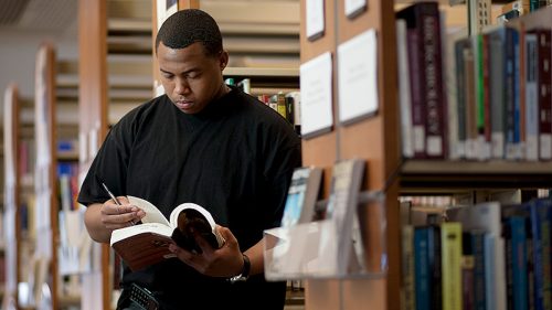 Man looking through a book
