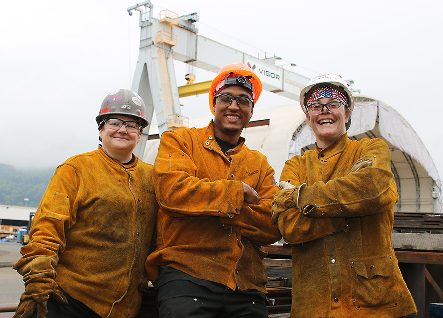 Smiling students standing in front of Maritime Training Center