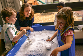 student working with children