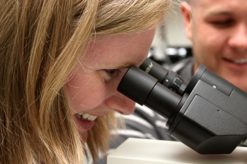 Biology instructor Annie Crater checks the work of student John McCall during a summer lab session. The lab is one of only two available for science classes at Southeast Center.