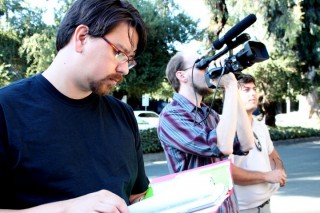 Robin Mihara, left, checks his notes during production of 'Ecstasy of Order: The Tetris Masters.'
