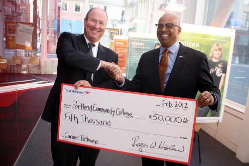 Roger Hinshaw (left), Bank of America President for Oregon and Southwest Washington, hands over the big check to PCC District President Preston Pulliams.