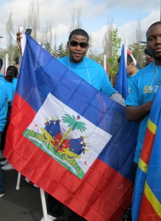 In April, Estanis, with his flag of Haiti, marched with fellow PCC students in the 82nd Avenue of Roses Parade.