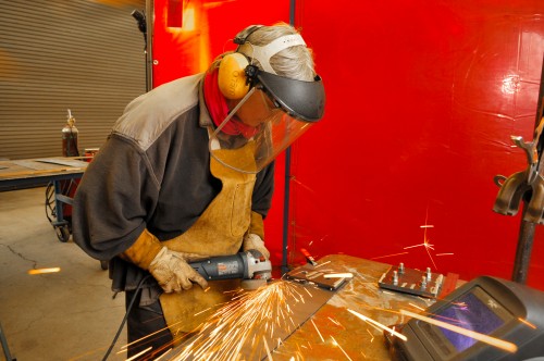 Welder- 035 Nicky Falkenhayn, a former student who learned her trade of industrial welding at PCC several years ago, is a professional artist specializing in welding and jewelry making.