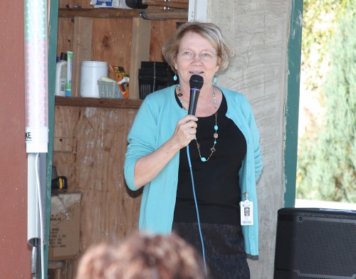 Birgitte Ryslinge chats with a crowd during the Rock Creek Learning Garden celebration last October.