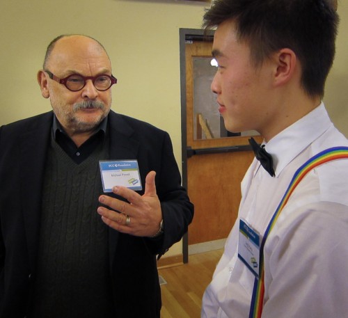Leng Yang (right), a Future Connect student who graduated from Reynolds High School, chats with Michael Powell, owner of Powell’s Bookstore.
