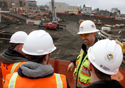 Jacob McKay (background), the Cascade superintendent for Hoffman Construction, welcomed students from the Trades Preparation (APR 200) class to his construction site.