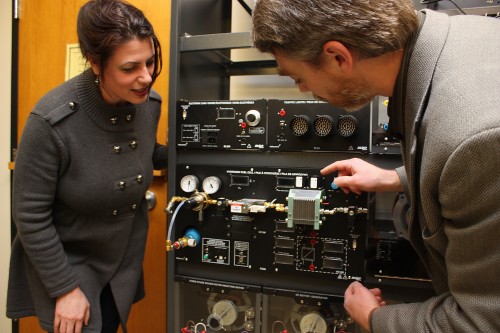 Electronic Engineering Technology Chair Sanda Williams and ClearEdge's Vice President of Engineering Tom Prevish inspect one of three Lab-Volt hydrogen fuel cell training systems that will be used for the new class.