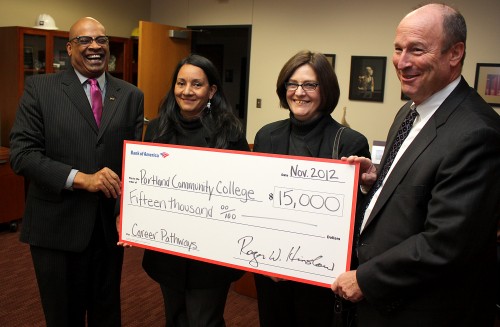 Barbie Cowan (middle right) joins, left to right, PCC President Preston Pulliams, fellow Career Pathways student Anna Coca and Bank of America President for Oregon and Southwest Washington Roger Hinshaw during a check donation ceremony for Career Pathways.