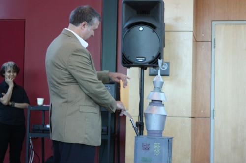 Jeremy Brown received a warm welcome at Sylvania. Here, he gets a special present from a robot. The gift is a 3-D etched picture of himself done on an auto machine tool.