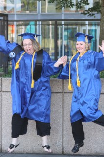 Two happy graduates from the 2013 PCC commencement ceremony.