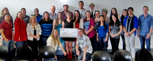 PCC students present the check to Friendly House.