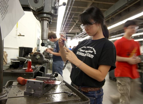Lynn Tran, a 17-year-old from Tigard High School, works on a robotics part during her lab at the Sylvania Campus.